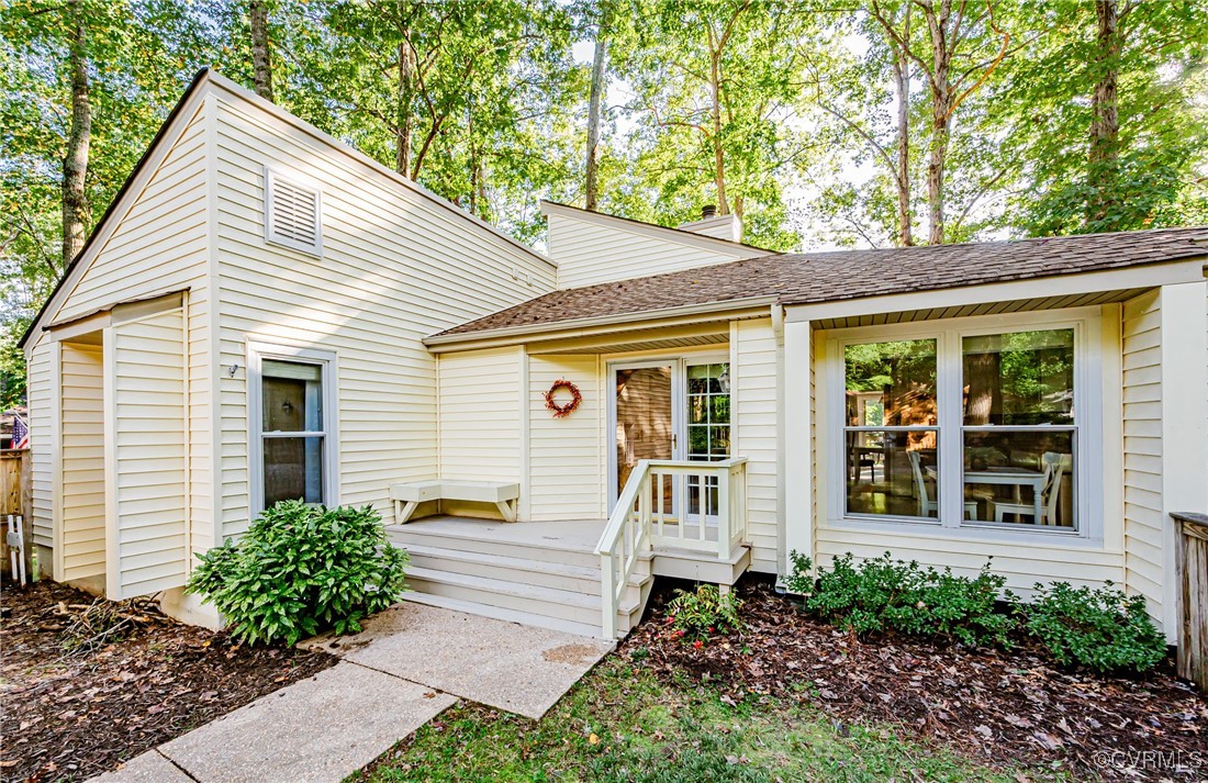 3100 3 Bridges Road Midlothian, VA 23112 - Photo 2 of 48 a view of a house with a small yard plants and large tree
