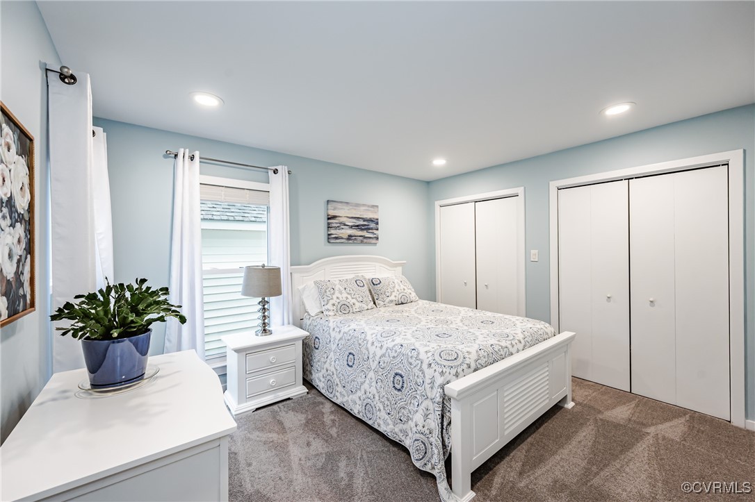 3100 3 Bridges Road Midlothian, VA 23112 - Photo 29 of 48 a bedroom with a large bed and a potted plant