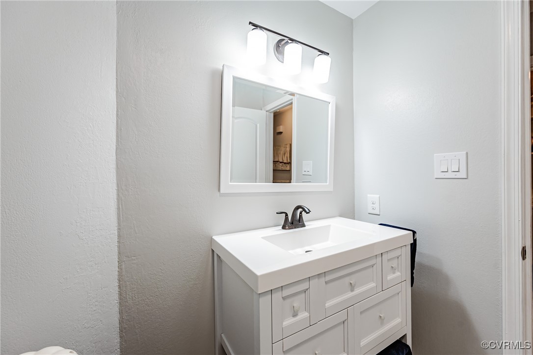 3100 3 Bridges Road Midlothian, VA 23112 - Photo 32 of 48 a bathroom with a sink and a mirror