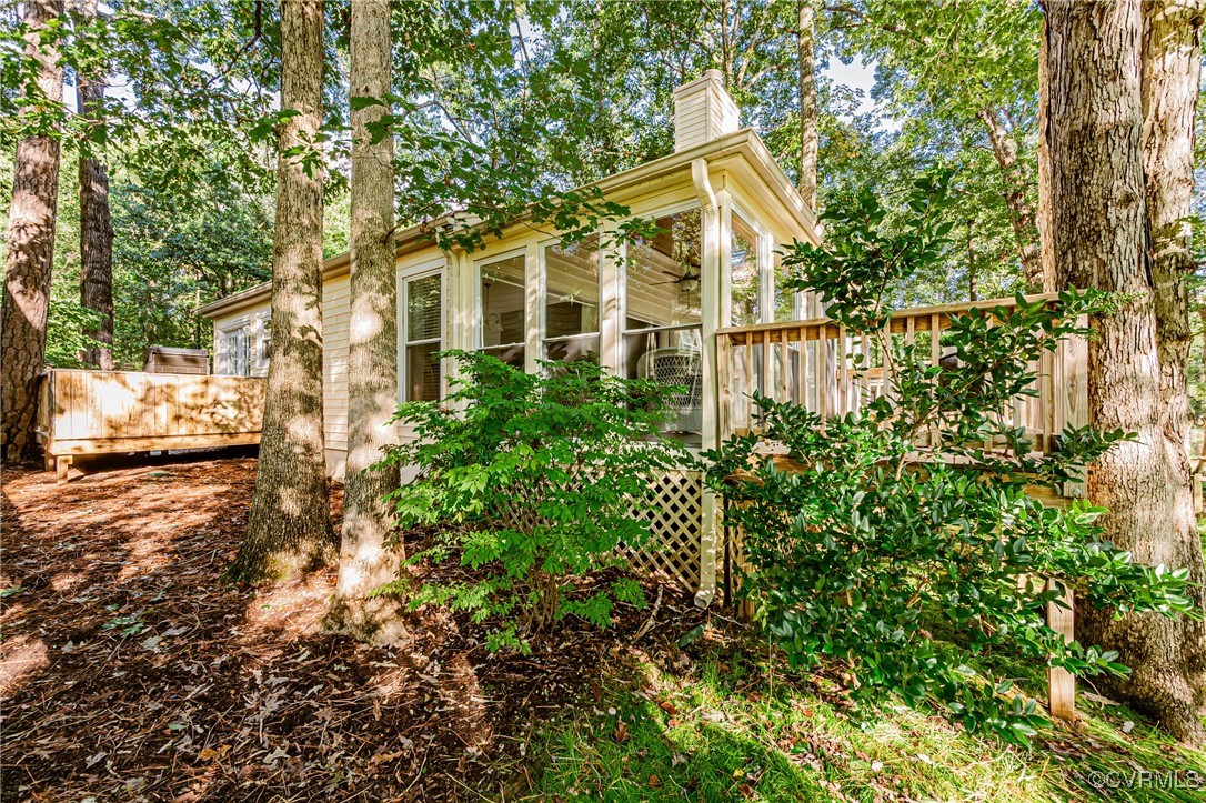3100 3 Bridges Road Midlothian, VA 23112 - Photo 39 of 48 a view of a white house with a small yard and large tree