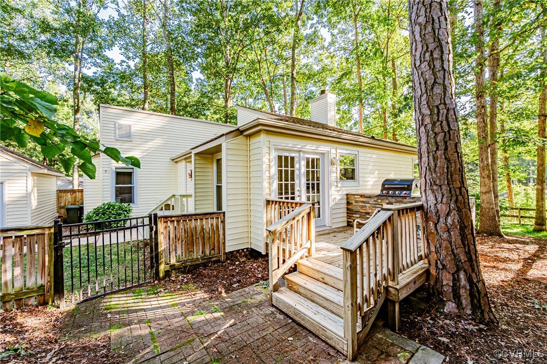 3100 3 Bridges Road Midlothian, VA 23112 - Photo 42 of 48 a view of a house with wooden deck and a large tree