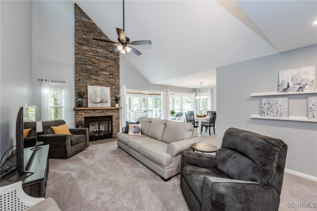 3100 3 Bridges Road Midlothian, VA 23112 - Photo 5 of 48 a living room with furniture a fireplace and a flat screen tv