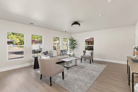 a living room with furniture and a window