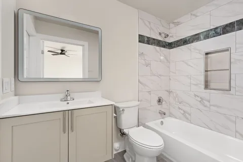 a bathroom with a sink a toilet and a bathtub