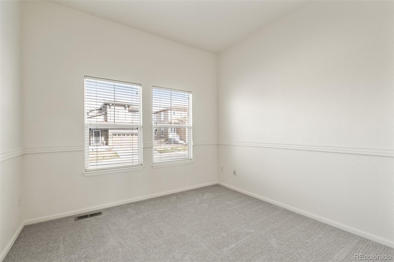 10665 Evondale Street Highlands Ranch, CO 80126 - Photo 17 of 45 an empty room with a window