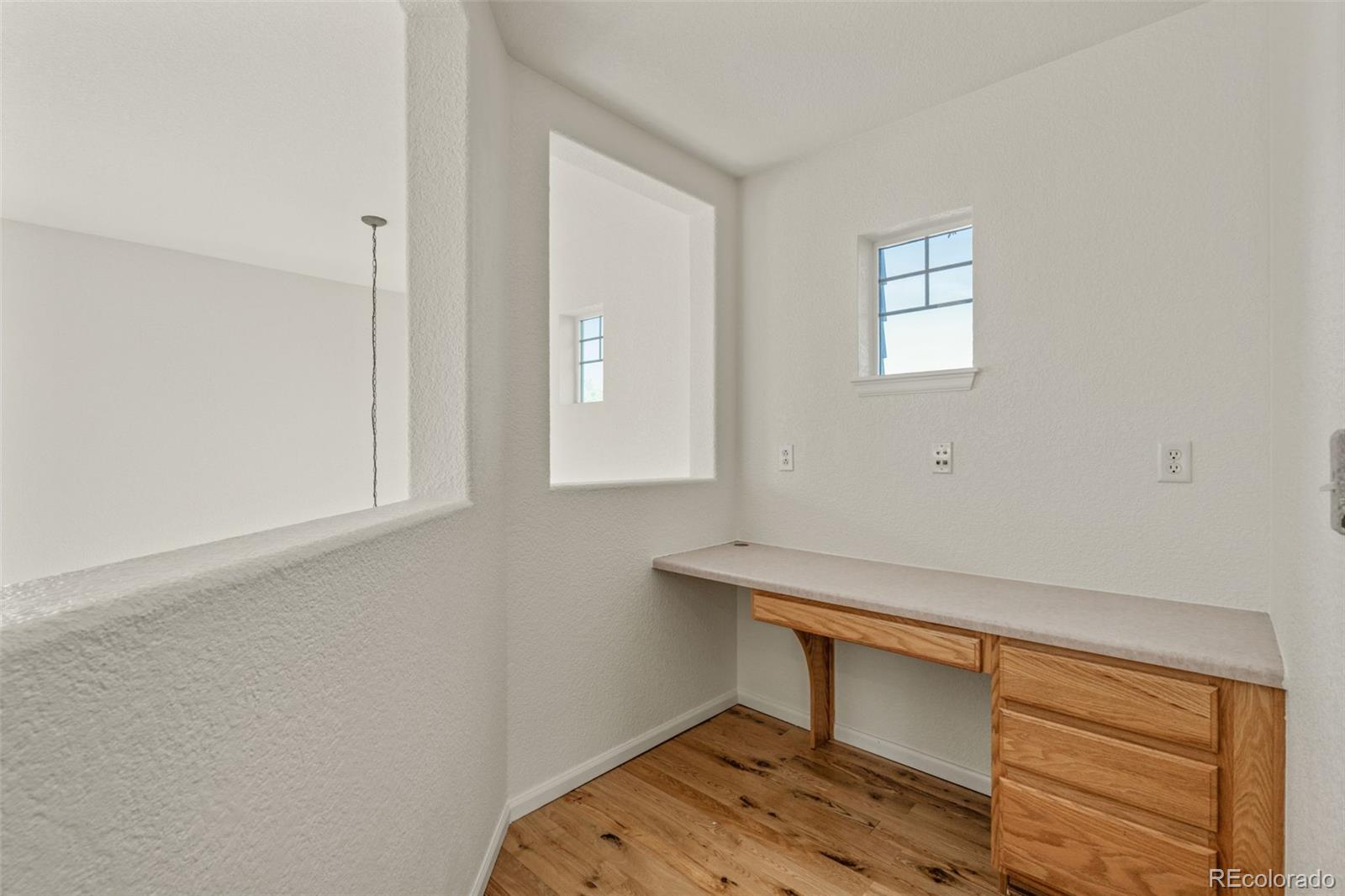 10665 Evondale Street Highlands Ranch, CO 80126 - Photo 27 of 45 a room that has a window and a table in it