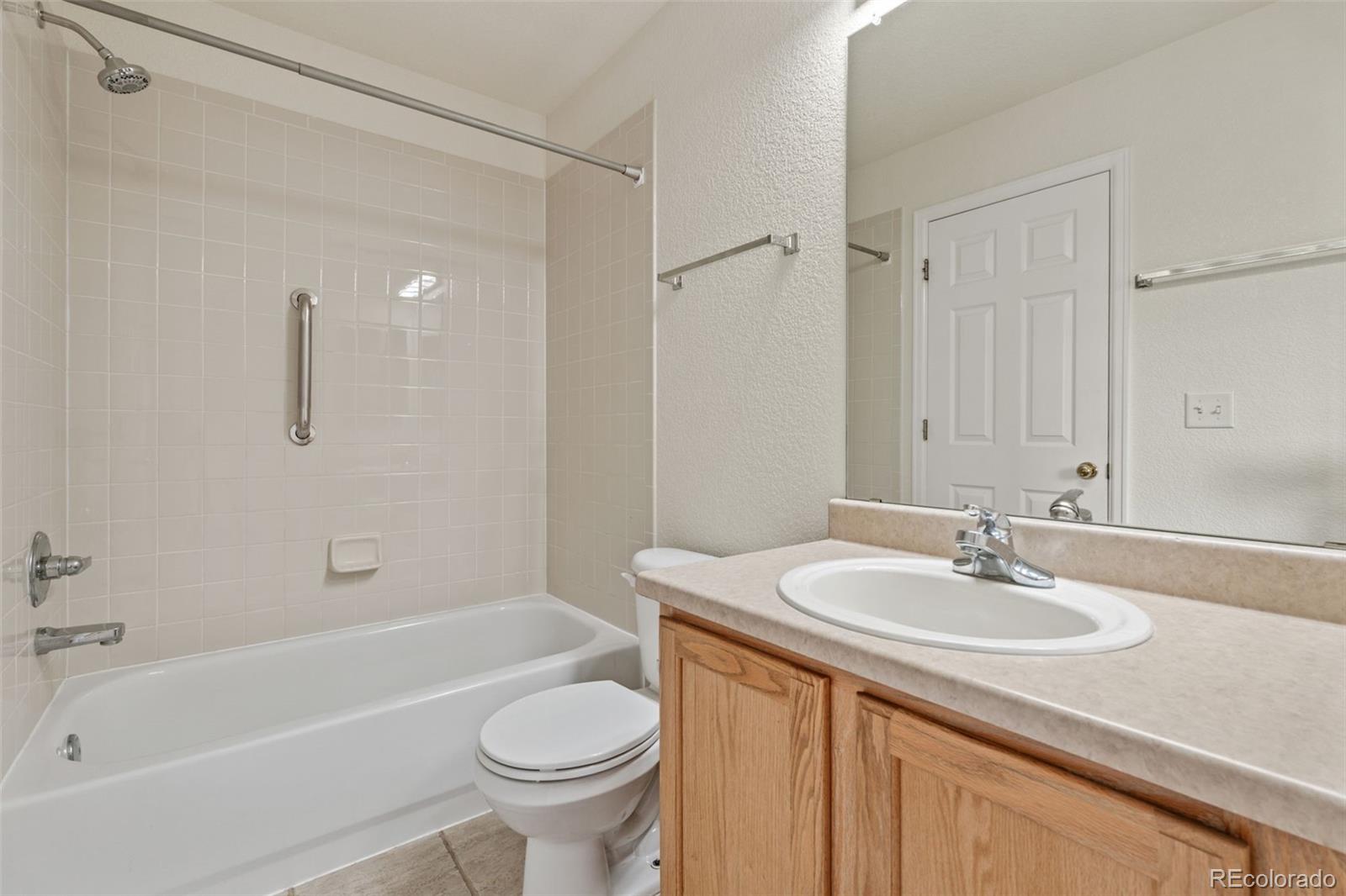 10665 Evondale Street Highlands Ranch, CO 80126 - Photo 29 of 45 a bathroom with a sink toilet and bathtub