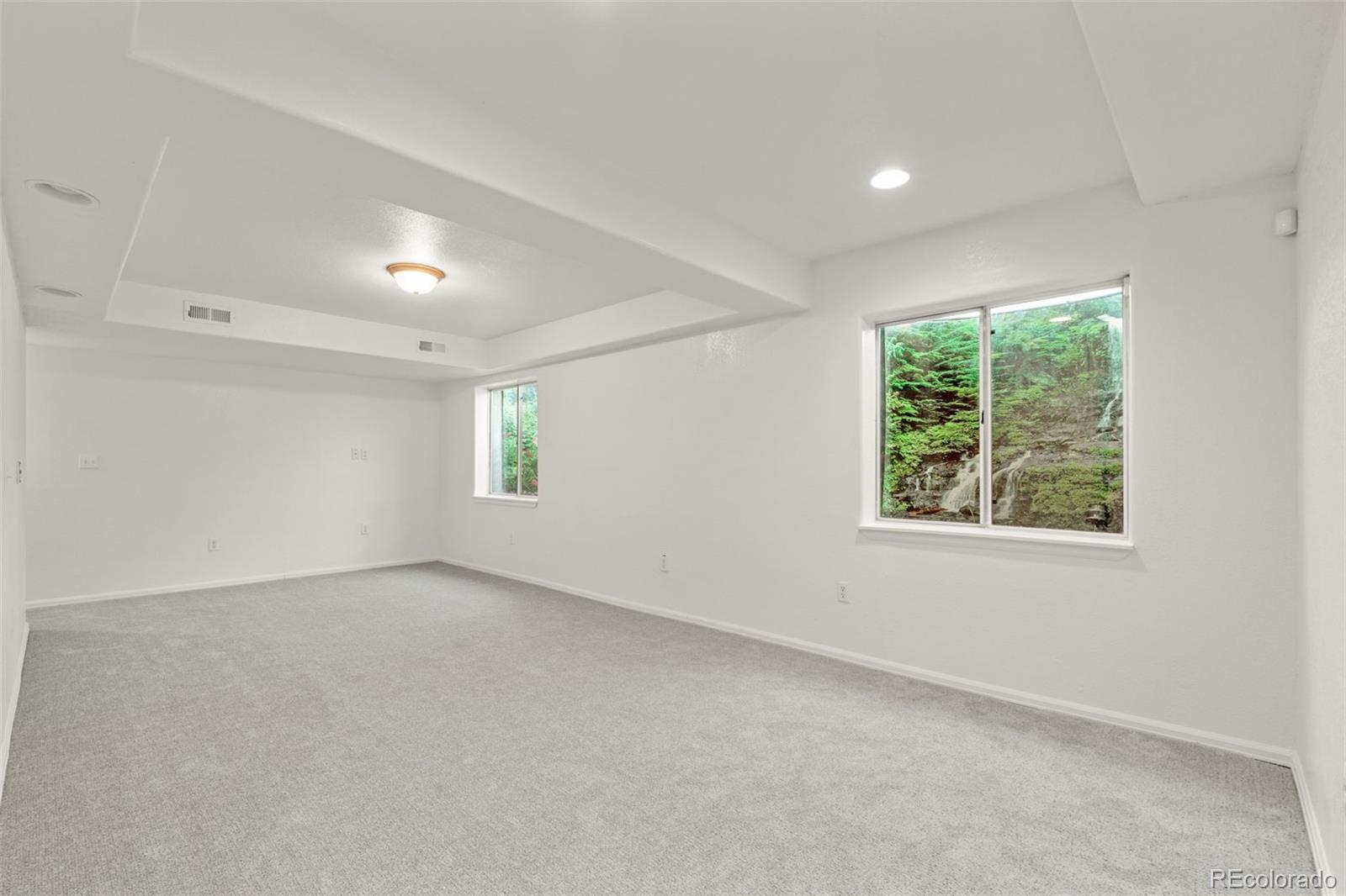 10665 Evondale Street Highlands Ranch, CO 80126 - Photo 32 of 45 an empty room with windows