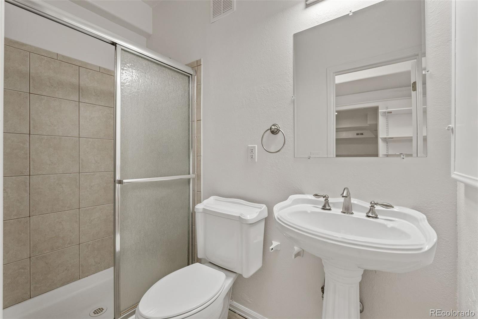 10665 Evondale Street Highlands Ranch, CO 80126 - Photo 35 of 45 a bathroom with a sink toilet and shower