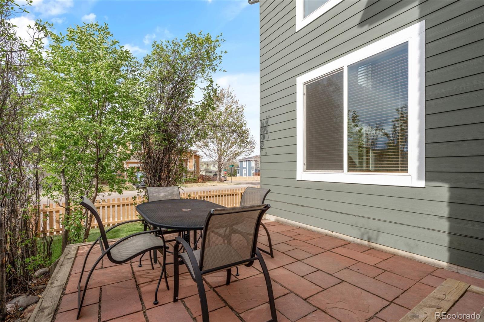 10665 Evondale Street Highlands Ranch, CO 80126 - Photo 37 of 45 a view of a wooden bench sitting in front of a house