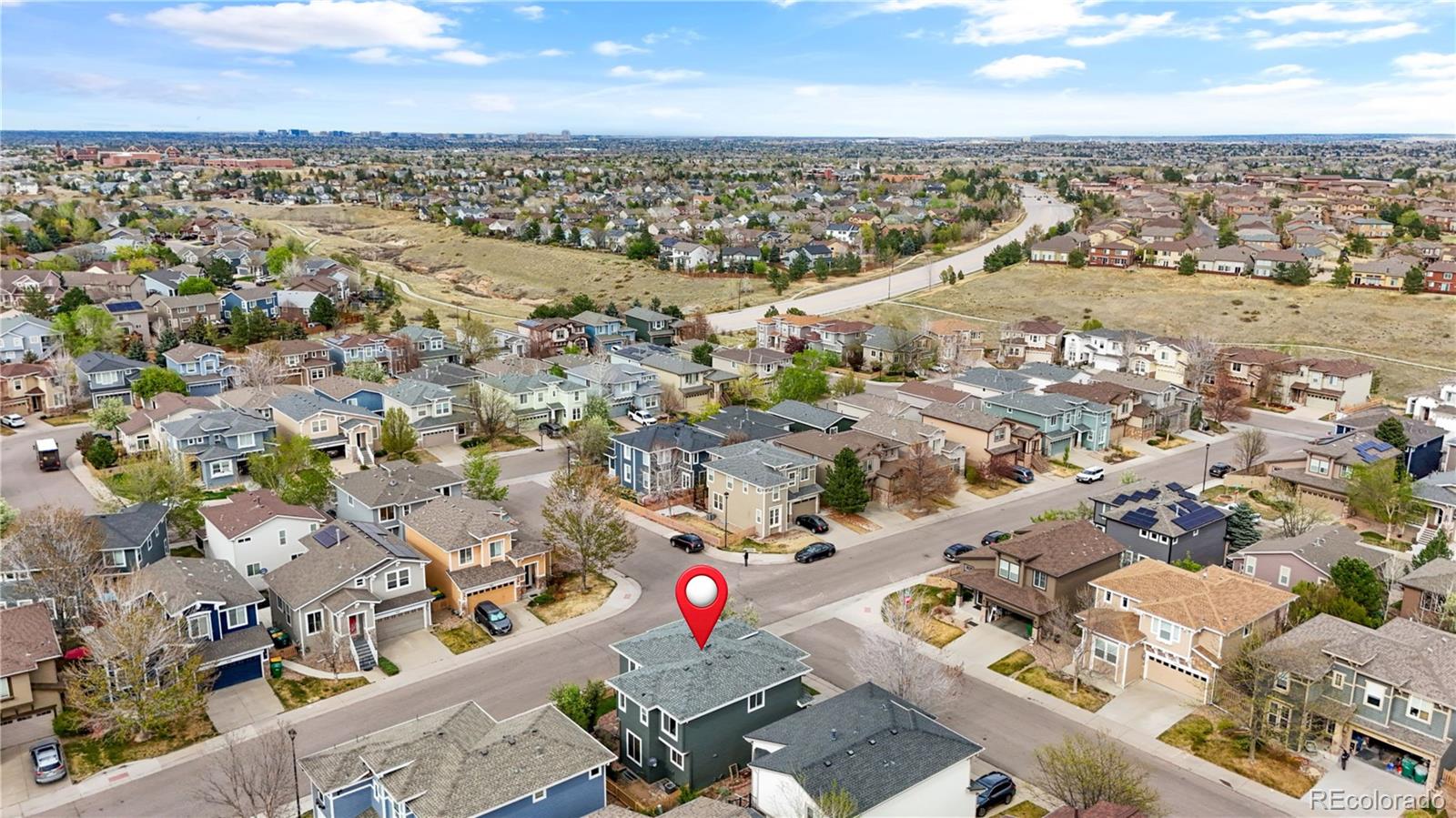 10665 Evondale Street Highlands Ranch, CO 80126 - Photo 41 of 45 an aerial view of a city with lots of residential buildings