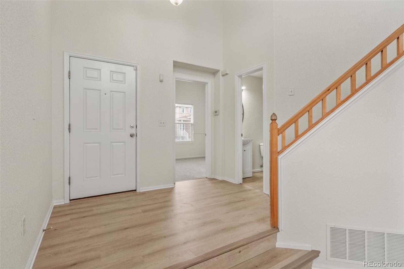 10665 Evondale Street Highlands Ranch, CO 80126 - Photo 5 of 45 a view of an entryway with wooden floor