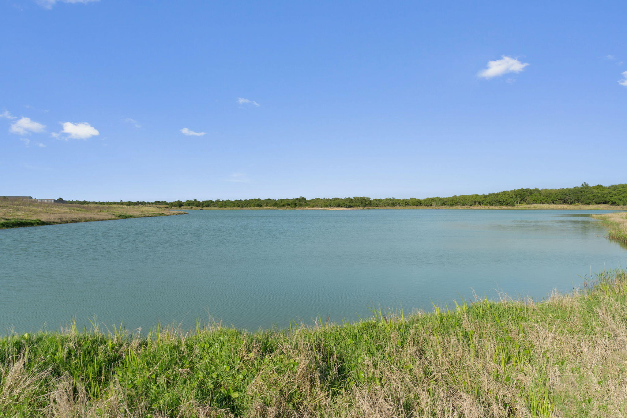 57 Huckleberry Street Freeport, FL 32439 - Photo 19 of 20 a view of a lake and a yard