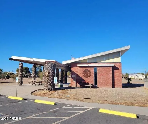 a view of a swimming pool with an outdoor space and seating area