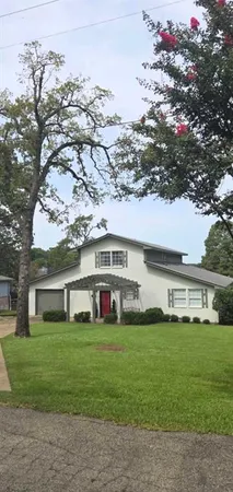 a front view of house with yard