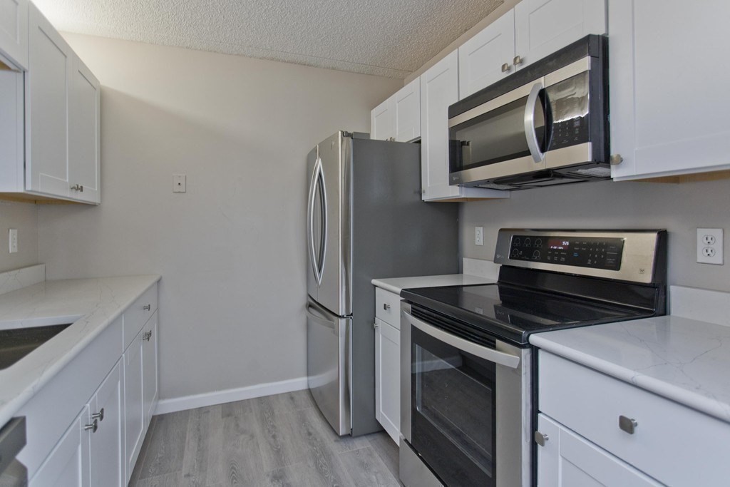 34 Maple Crest Circle, Unit D Holyoke, MA 01040 - Photo 13 of 22 a kitchen with a refrigerator stove and microwave