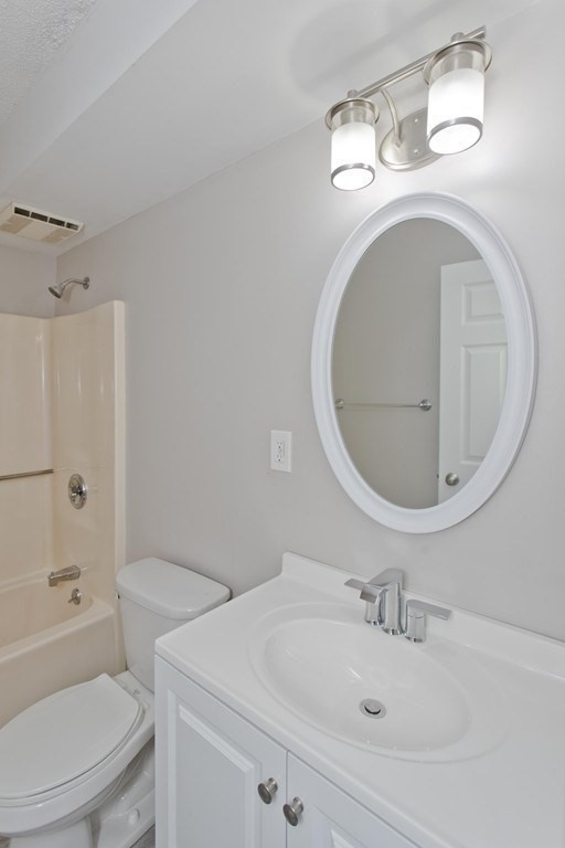 34 Maple Crest Circle, Unit D Holyoke, MA 01040 - Photo 17 of 22 a bathroom with a sink a toilet and shower
