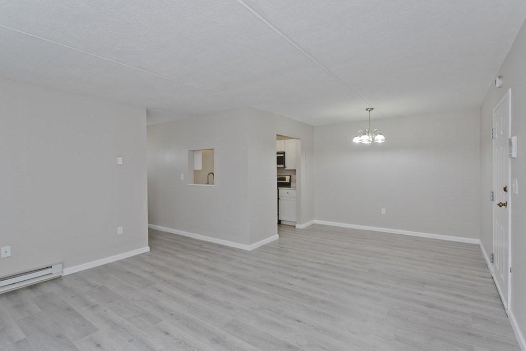 34 Maple Crest Circle, Unit D Holyoke, MA 01040 - Photo 4 of 22 a view of an empty room with wooden floor