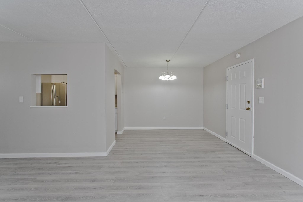 34 Maple Crest Circle, Unit D Holyoke, MA 01040 - Photo 5 of 22 a view of an empty room with wooden floor