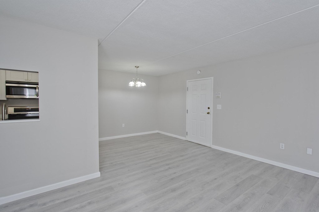 34 Maple Crest Circle, Unit D Holyoke, MA 01040 - Photo 6 of 22 wooden floor in an empty room
