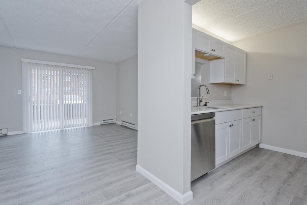 34 Maple Crest Circle, Unit D Holyoke, MA 01040 - Photo 8 of 22 a view of a kitchen with wooden floor and electronic appliances