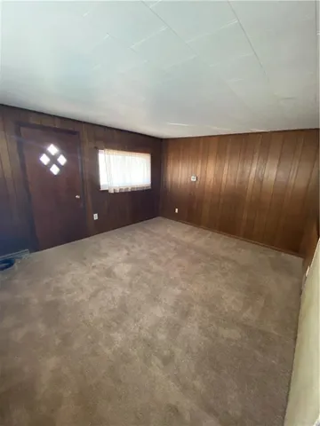 a kitchen with a wooden floor and a stove