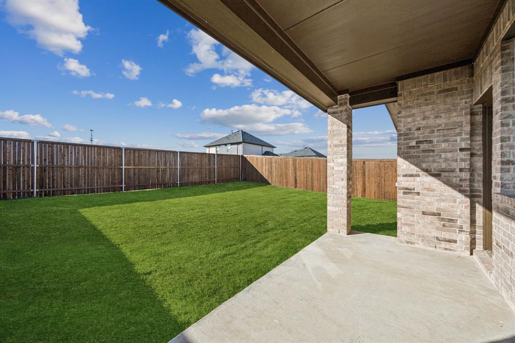 425 Magellan Road Seagoville, TX 75159 - Photo 15 of 36 a view of a backyard with plants