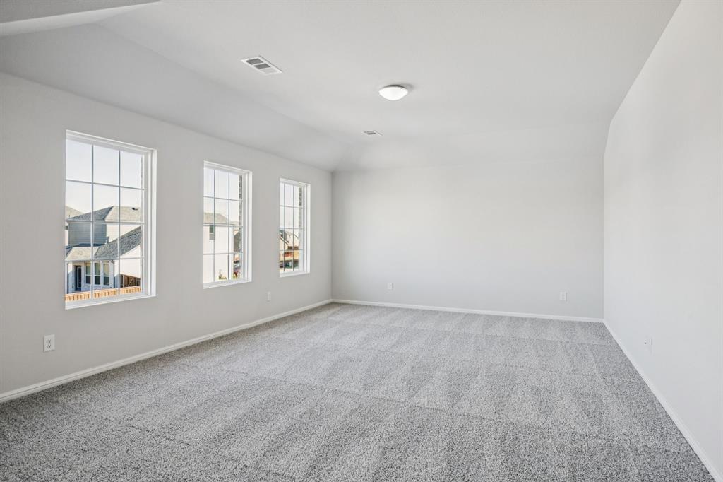 425 Magellan Road Seagoville, TX 75159 - Photo 9 of 36 an empty room with windows