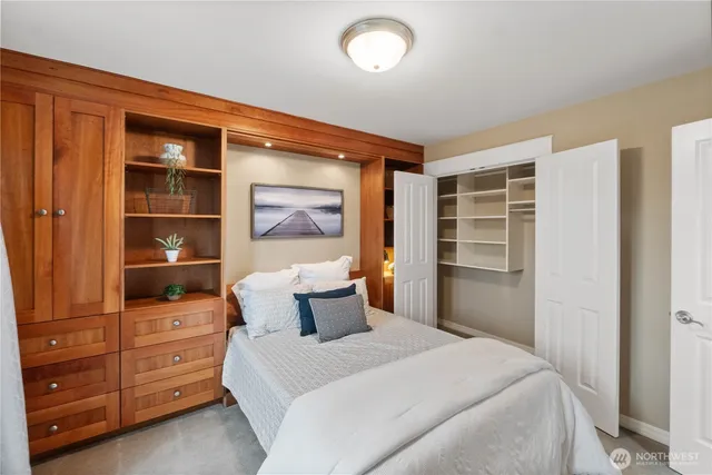 a bedroom with a bed and a dresser