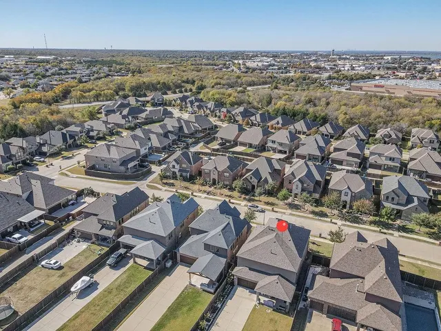 an aerial view of a city with lots of residential buildings