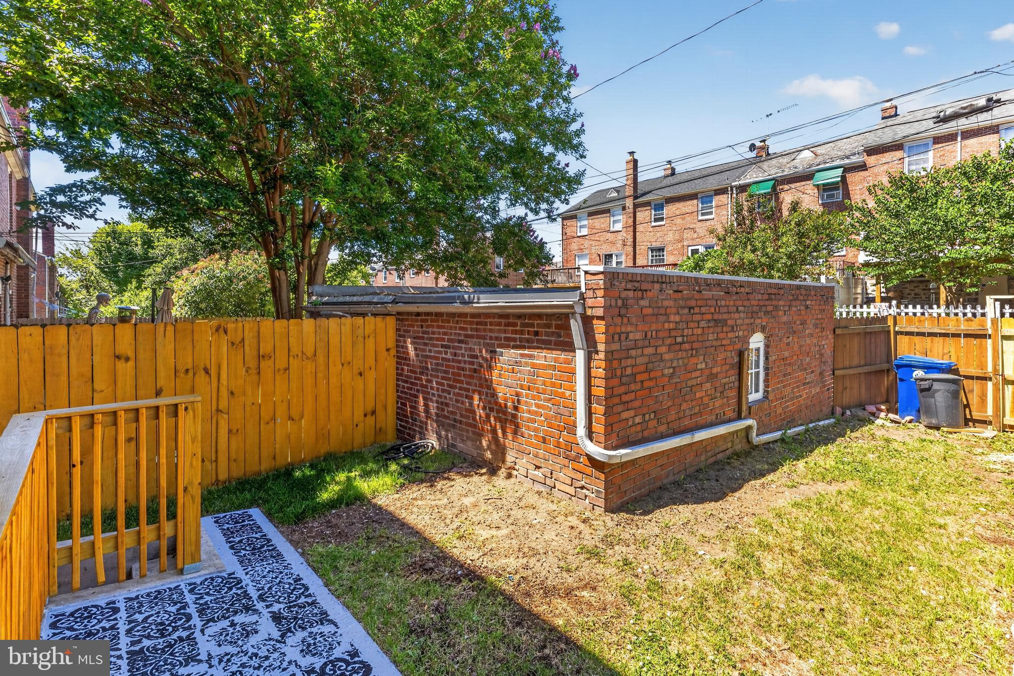 3906 Yolando Road Baltimore, MD 21218 - Photo 27 of 30 a view of backyard with wooden fence and trees