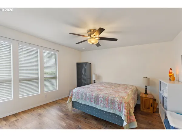 a bedroom with a bed and a table in it