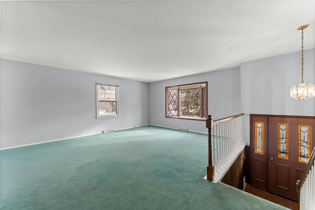a view of an empty room and closet area