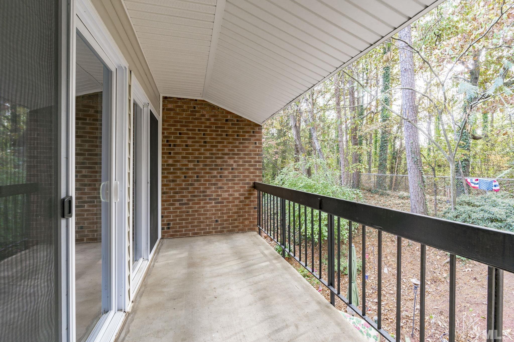 4505 Edwards Mill Road, Unit G Raleigh, NC 27612 - Photo 13 of 31 a view of a balcony with wooden floor