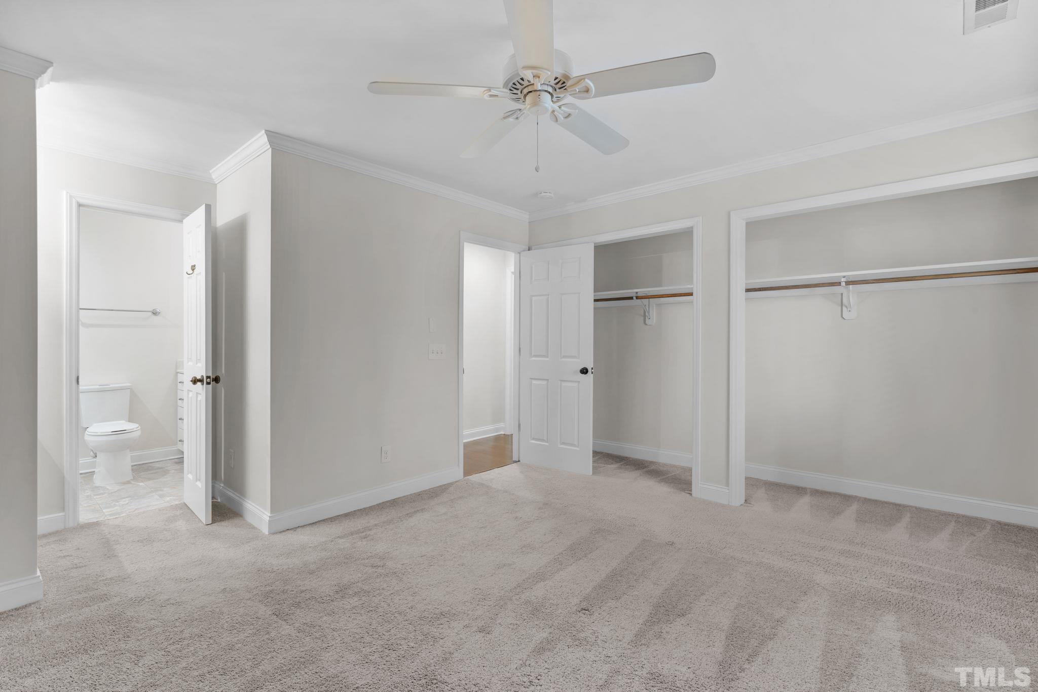4505 Edwards Mill Road, Unit G Raleigh, NC 27612 - Photo 17 of 31 a view of an empty room and a ceiling fan window