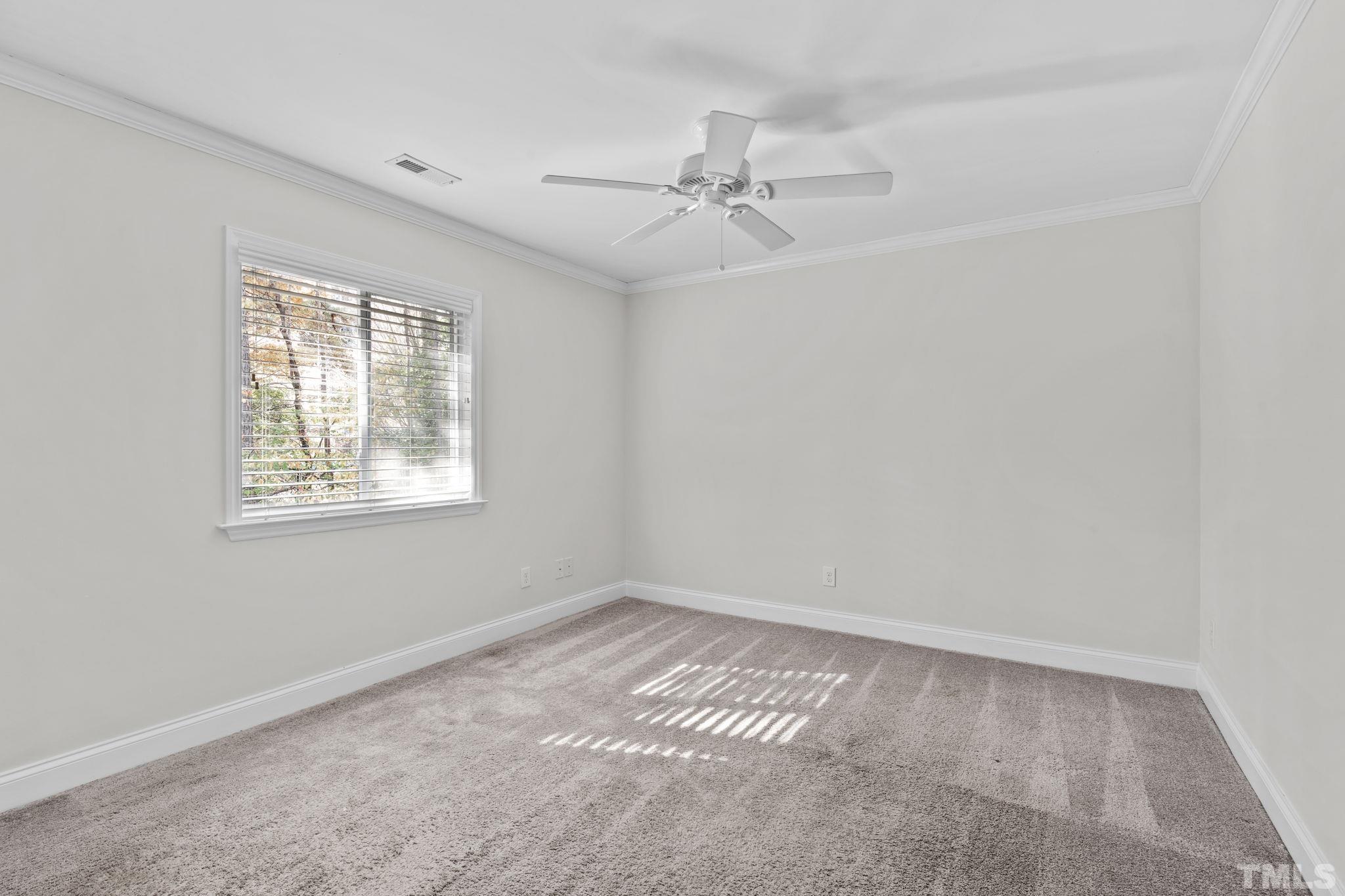 4505 Edwards Mill Road, Unit G Raleigh, NC 27612 - Photo 25 of 31 a view of an empty room with a window