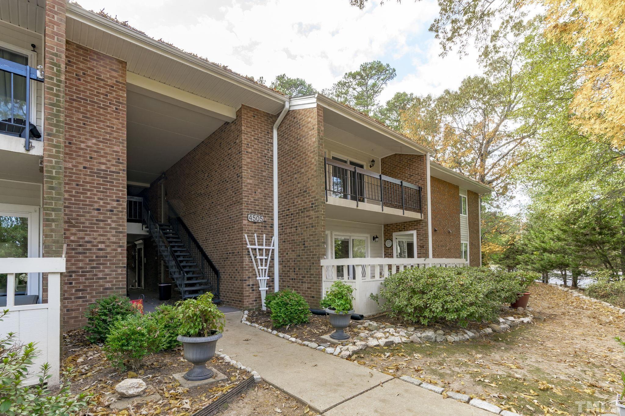 4505 Edwards Mill Road, Unit G Raleigh, NC 27612 - Photo 27 of 31 a view of a house with a yard