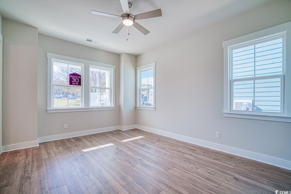 3810 Richardson Street Loris, SC 29569 - Photo 20 of 40 Unfurnished room featuring hardwood / wood-style floors and ceiling fan