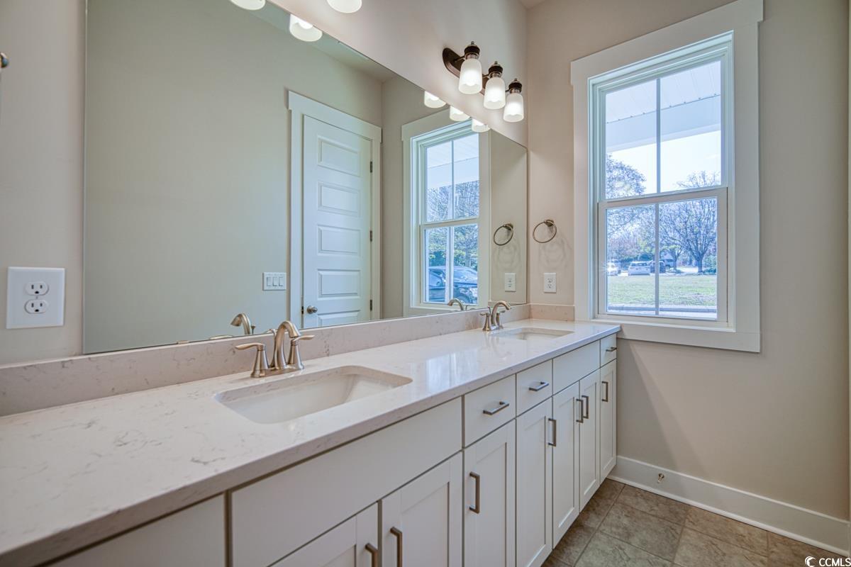 3810 Richardson Street Loris, SC 29569 - Photo 25 of 40 Bathroom featuring double vanity and light tile patterned flooring