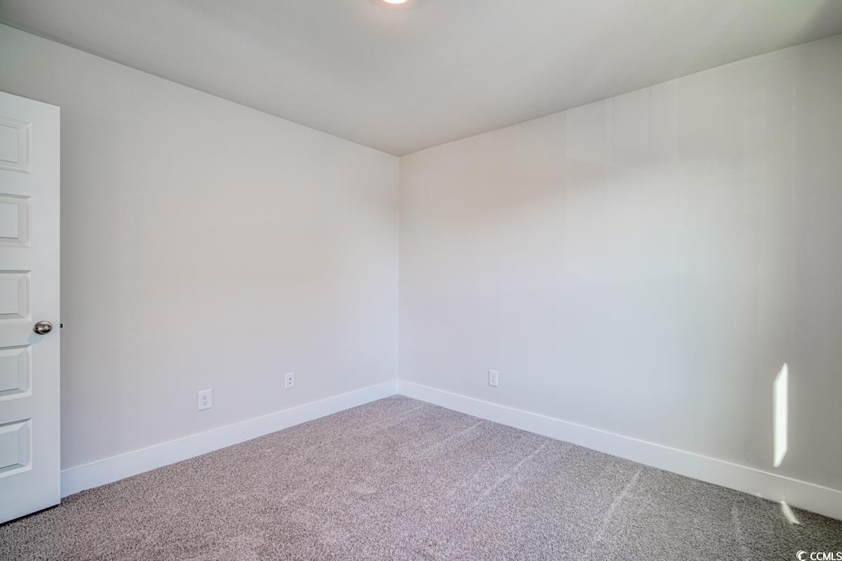 3810 Richardson Street Loris, SC 29569 - Photo 30 of 40 Carpeted empty room featuring baseboards