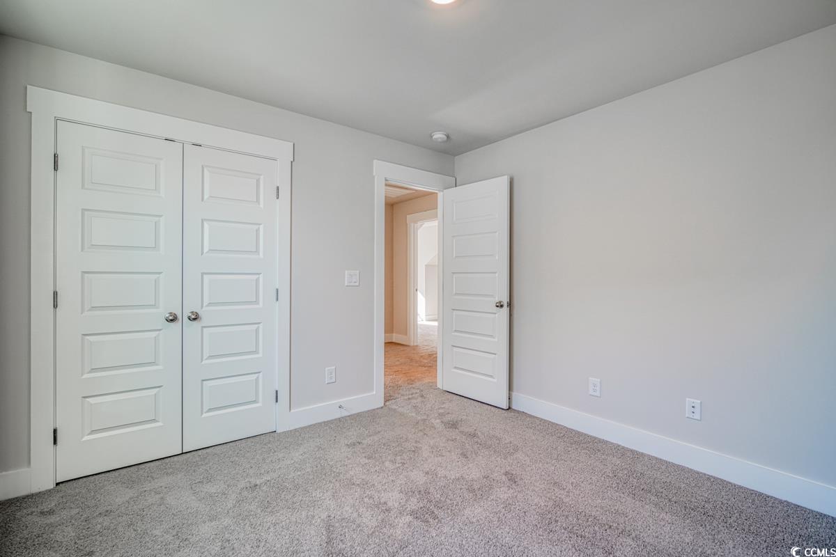 3810 Richardson Street Loris, SC 29569 - Photo 31 of 40 Unfurnished bedroom with carpet and a closet