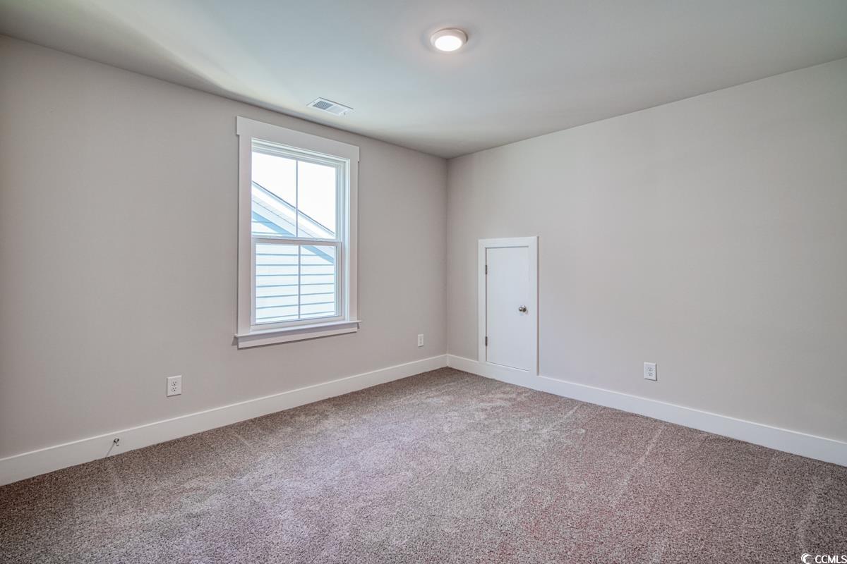 3810 Richardson Street Loris, SC 29569 - Photo 34 of 40 Unfurnished room featuring baseboards and light carpet