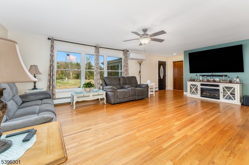 417 Mountain Road Lebanon, NJ 08833 - Photo 14 of 40 a living room with furniture and a flat screen tv