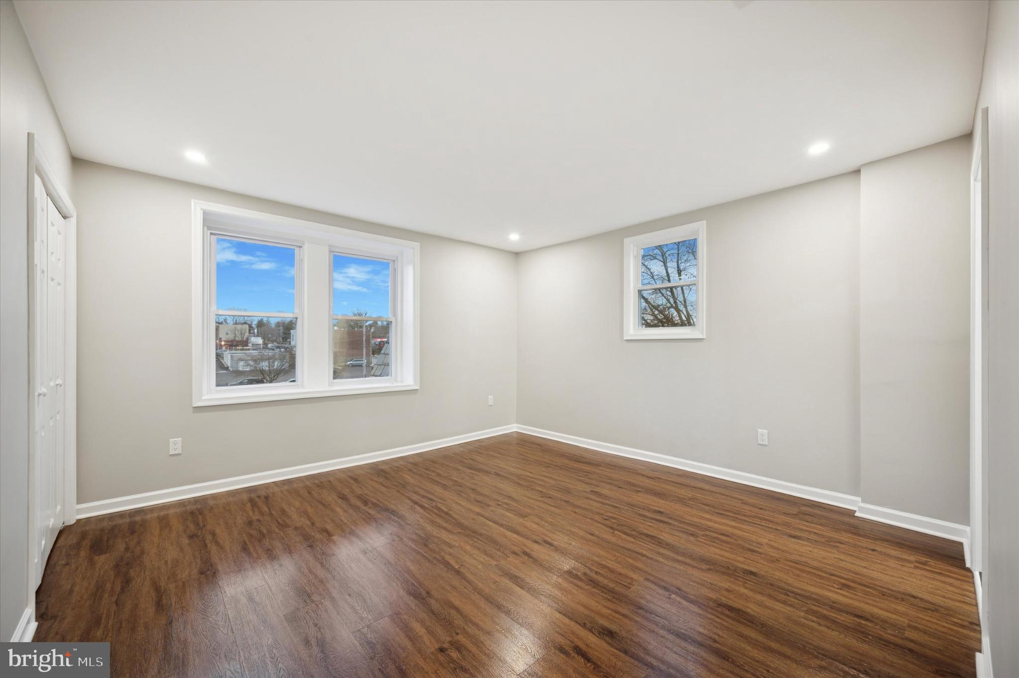 6416 North 15th Street Philadelphia, PA 19126 - Photo 15 of 23 a view of an empty room with wooden floor and a window
