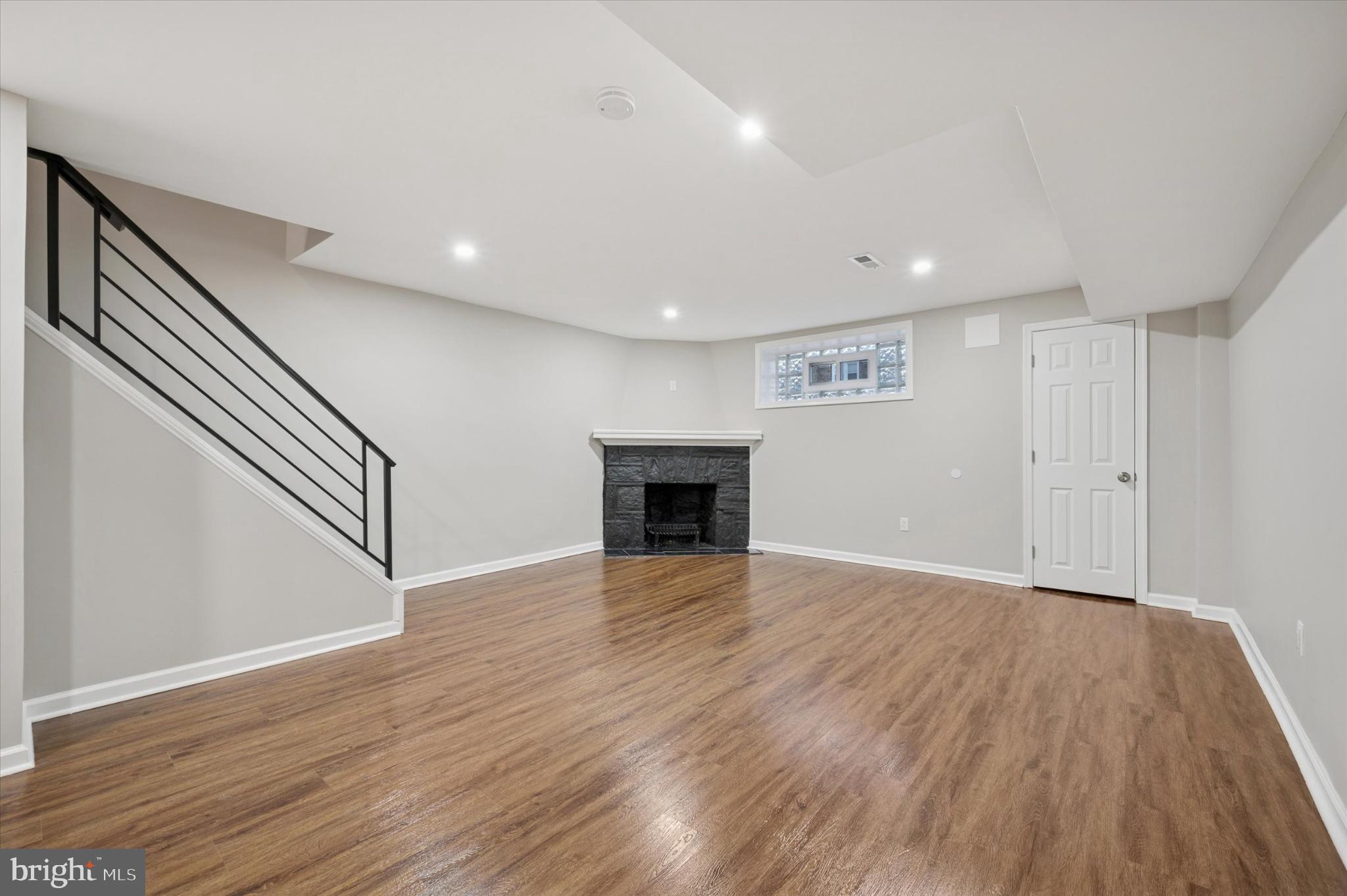 6416 North 15th Street Philadelphia, PA 19126 - Photo 18 of 23 a view of an empty room with wooden floor and a window