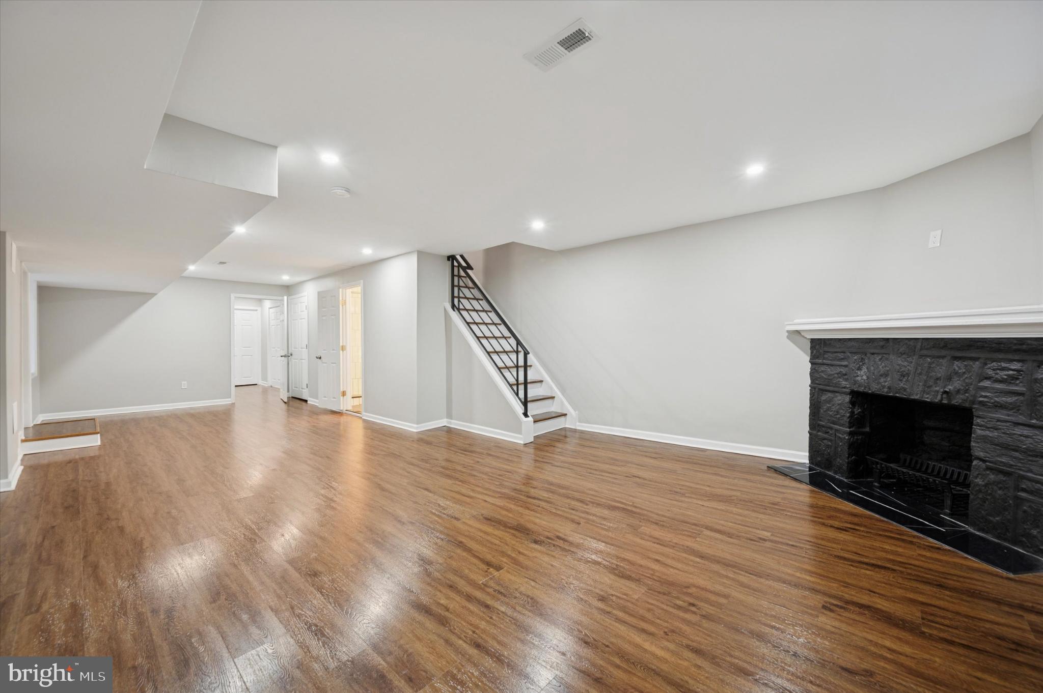 6416 North 15th Street Philadelphia, PA 19126 - Photo 19 of 23 a view of an empty room with wooden floor fire place