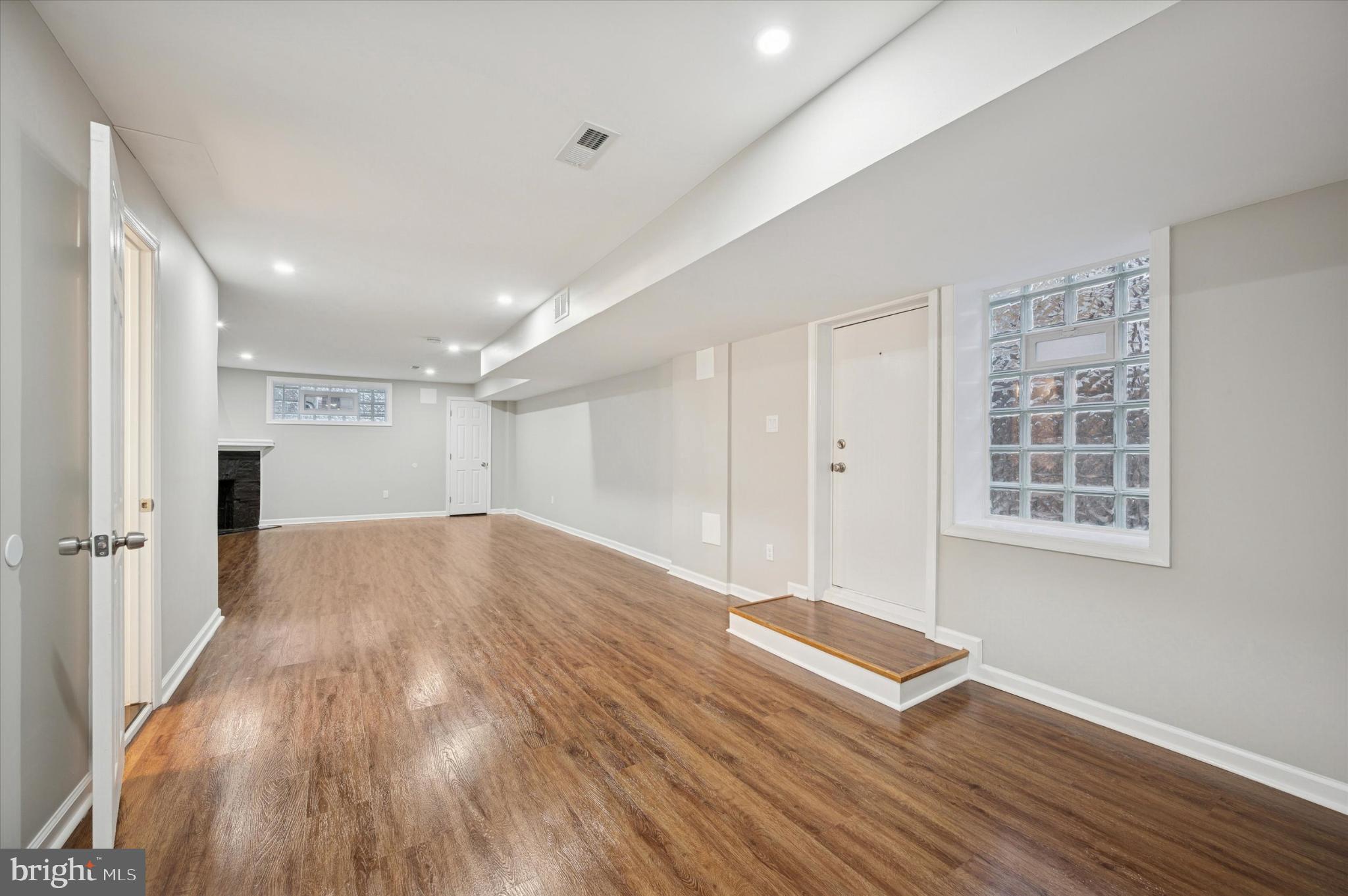 6416 North 15th Street Philadelphia, PA 19126 - Photo 20 of 23 an empty room with wooden floor and windows
