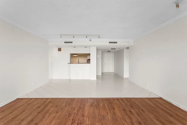 an empty room with wooden floor