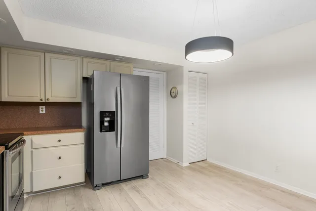 an empty room with cabinet and cabinet