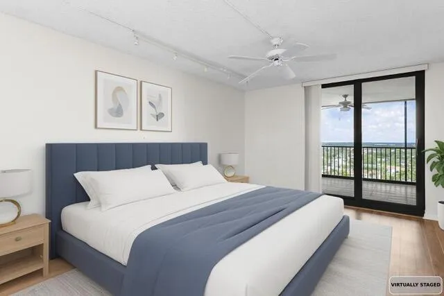 a bedroom with a large bed and a large window